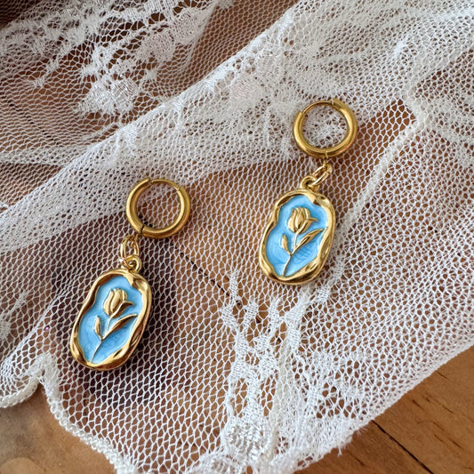 Rêve d’Azur - Boucle d’oreilles dorés rose sur fond bleu